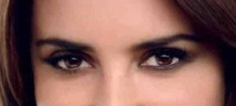 Image: Close-up of a woman's eyes, expressing an intense and captivating gaze, with dark eyeliner and impeccably styled eyebrows, reminiscent of Penelope Cruz. -- D.C. Douglas