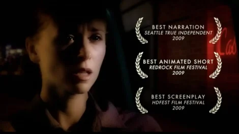 Short Films Library: D.c. Douglas | D.c. Douglas A close-up of a female character with a serious expression, awards displayed on the side.