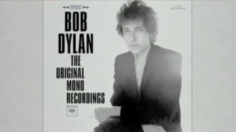 Album cover featuring Bob Dylan with tousled hair and a black suit for The Original Mono Recordings.