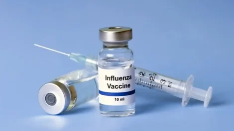 Voice Over: Radio, Streaming, &Amp; Podcast Commercials | D.c. Douglas Vial labeled 'Influenza Vaccine' with a syringe and needle on a blue background.