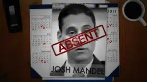 Image of Josh Mandel with a red 'ABSENT' stamp across his photo on a calendar background.