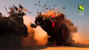 An explosion occurring from a vehicle in a desert landscape, with debris flying in various directions.