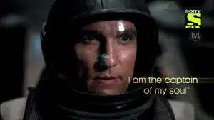 Close-up of an astronaut wearing a space helmet with a reflective visor and serious expression.