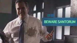 Gadfly: Breaking News &Amp; Tweaked Nipples | D.c. Douglas Man wearing a white shirt with stains, holding a remote and standing in a room with text overlay that says 'Beware Santorum'.