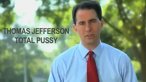 Gadfly: Breaking News &Amp; Tweaked Nipples | D.c. Douglas Man wearing a light blue shirt and red tie standing outdoors with trees in the background.