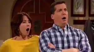 A man and a woman displaying surprised expressions with their mouths open, the woman yawning.