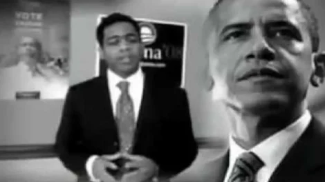 Black and white image featuring Barack Obama with a man speaking in the background.
