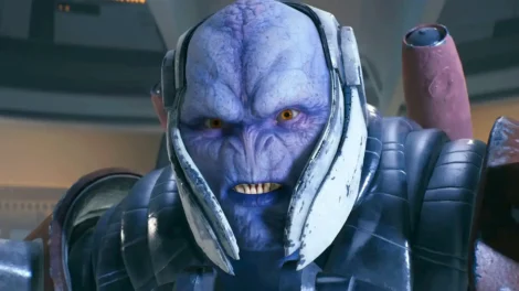 Close-up of a blue alien character wearing futuristic armor and a headset.