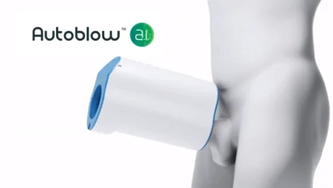 Autoblow AI device attached to a mannequin's lower body in a neutral setting.